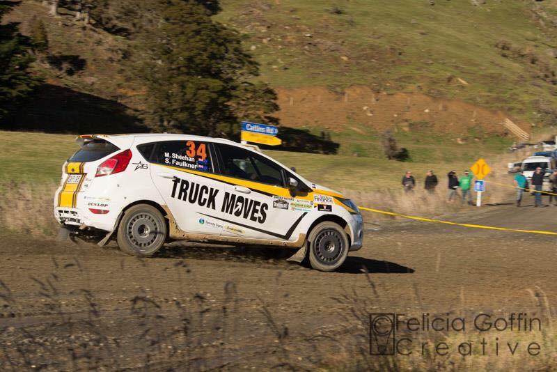Landscape driver inspecting a truck engine